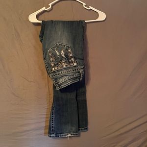 Miss Me Jean. Light pink accents.